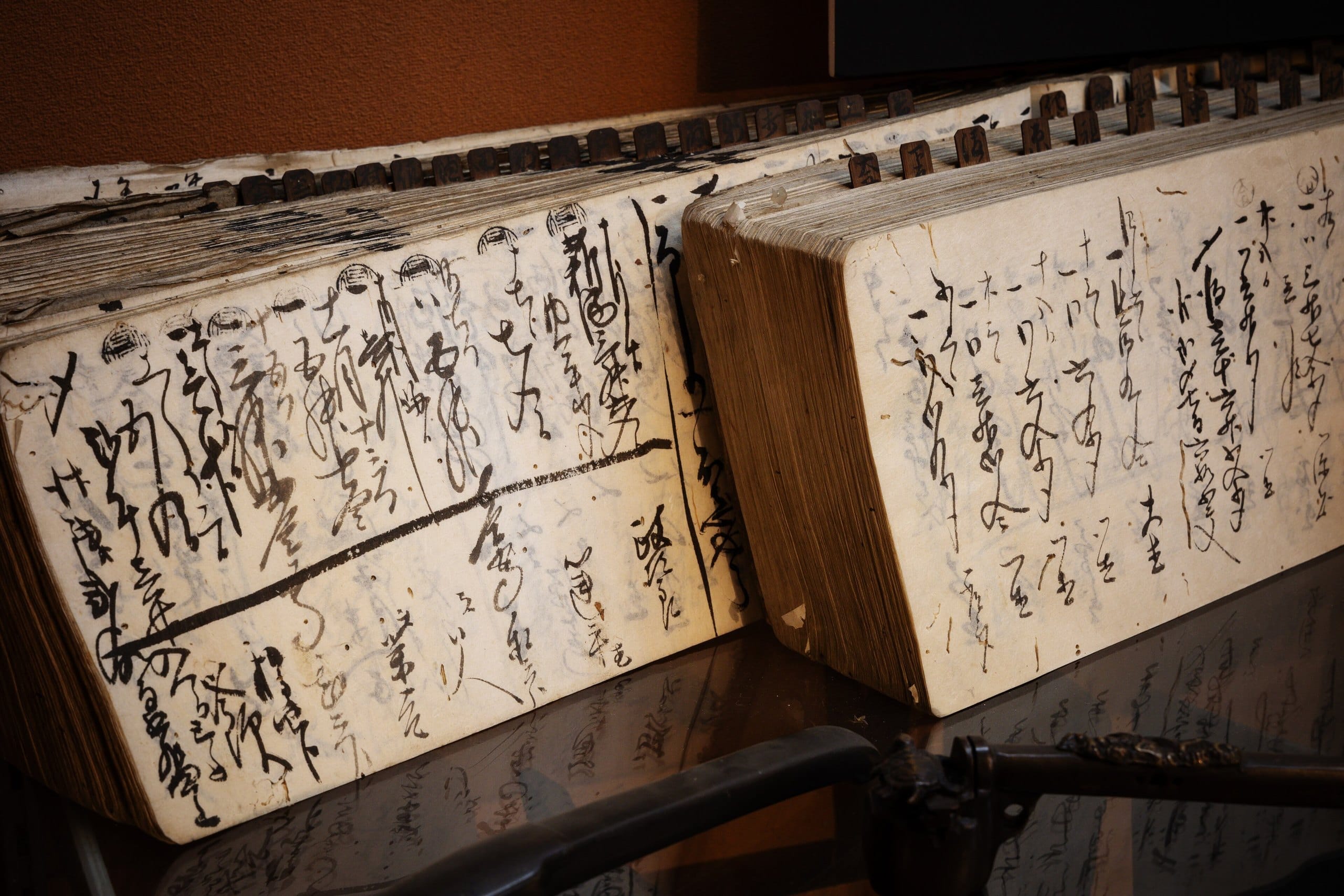 Old Japanese account ledgers with handwritten brush entries